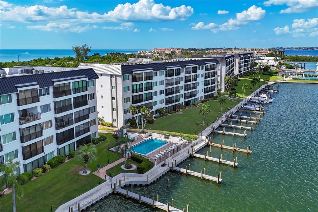 9011 Midnight Pass Road, Unit 426 Sarasota, FL 34242 - Photo 33 of 53 a view of a chairs and table in the garden