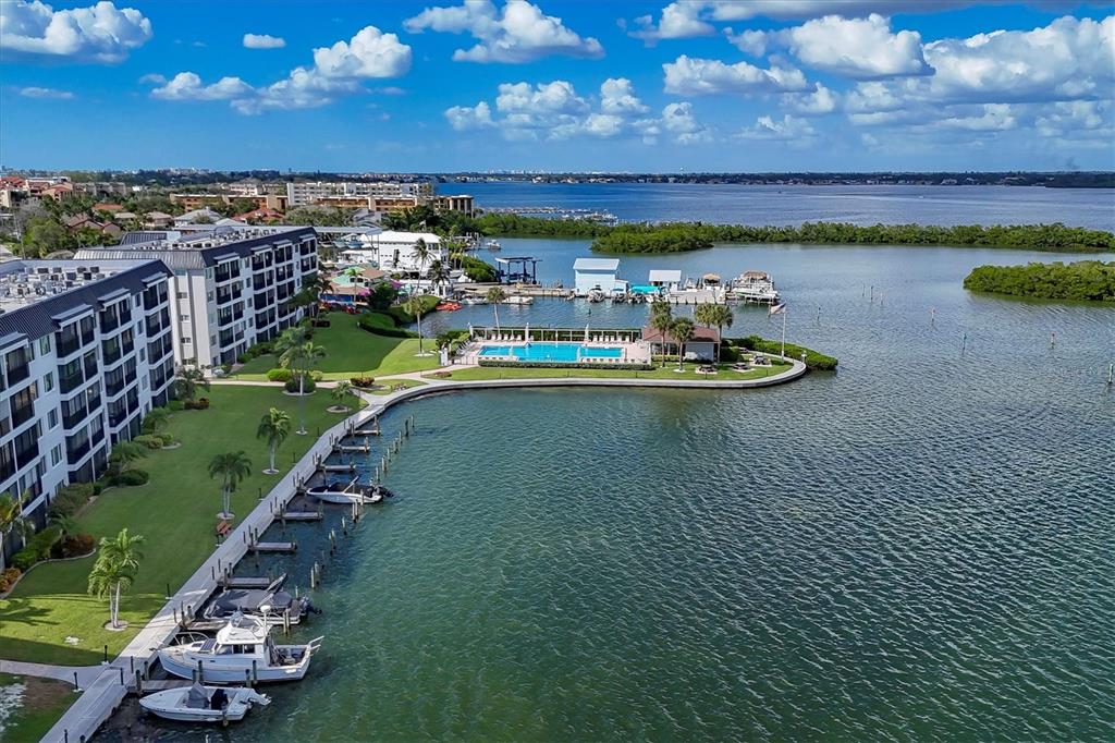 9011 Midnight Pass Road, Unit 426 Sarasota, FL 34242 - Photo 34 of 53 a view of a city with lawn chairs