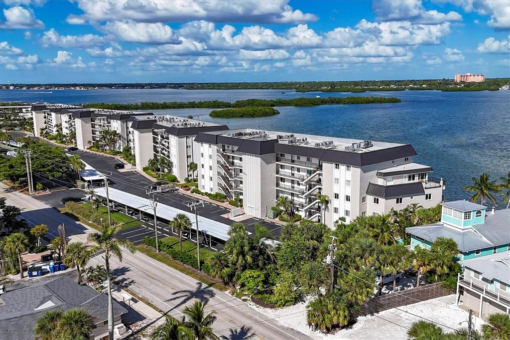 9011 Midnight Pass Road, Unit 426 Sarasota, FL 34242 - Photo 5 of 53 an aerial view of a house with a garden