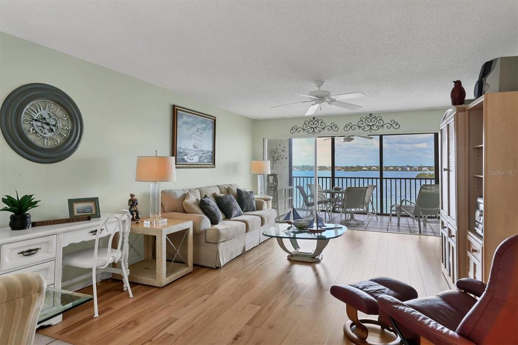 9011 Midnight Pass Road, Unit 426 Sarasota, FL 34242 - Photo 10 of 53 a living room with furniture and a large window