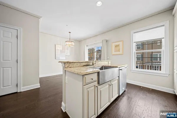 a kitchen with a stove and a window