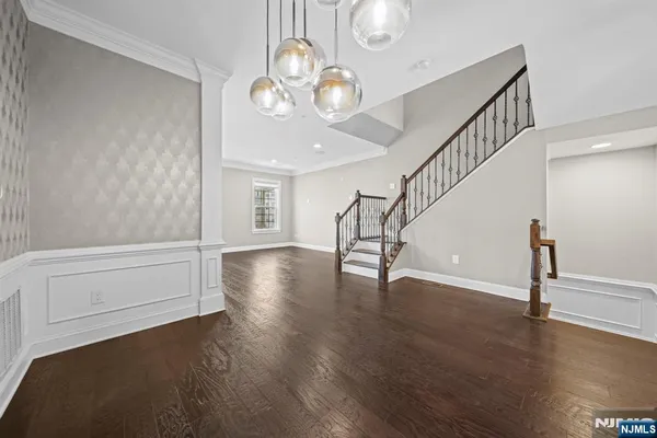 a view of an entryway with wooden floor