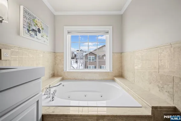 a bathroom with a bathtub and window