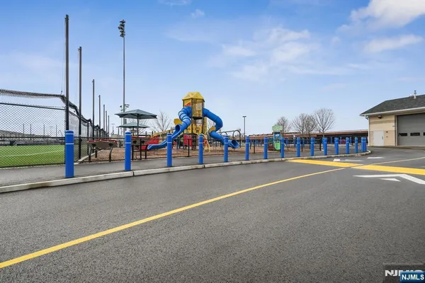 a childrens park with lots of swings and slides