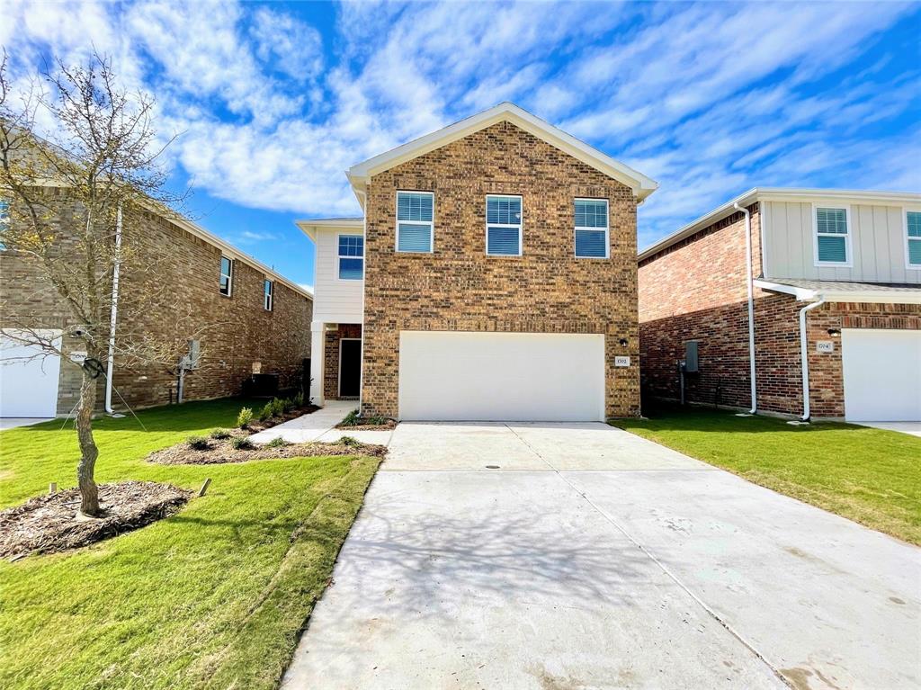 1702 Chapel Hl Road Princeton, TX 75407 - Photo 1 of 24 a front view of a house with a yard and garage