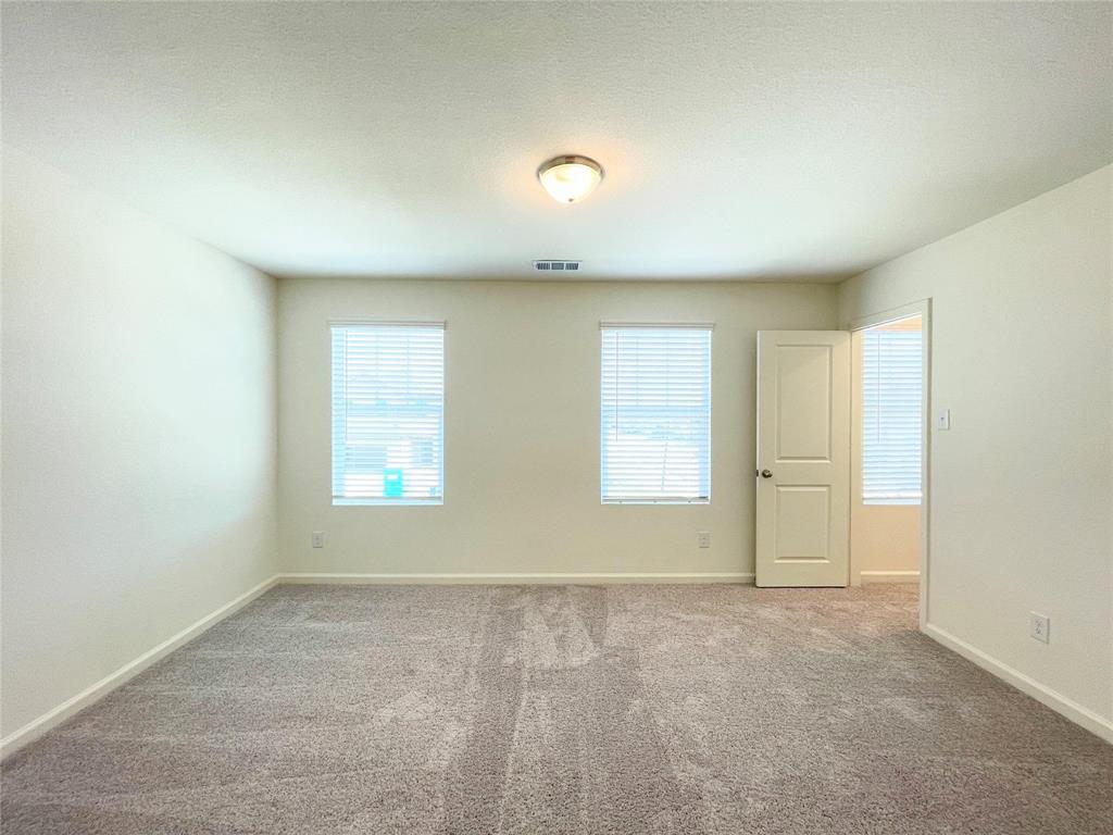 1702 Chapel Hl Road Princeton, TX 75407 - Photo 13 of 24 an empty room with windows
