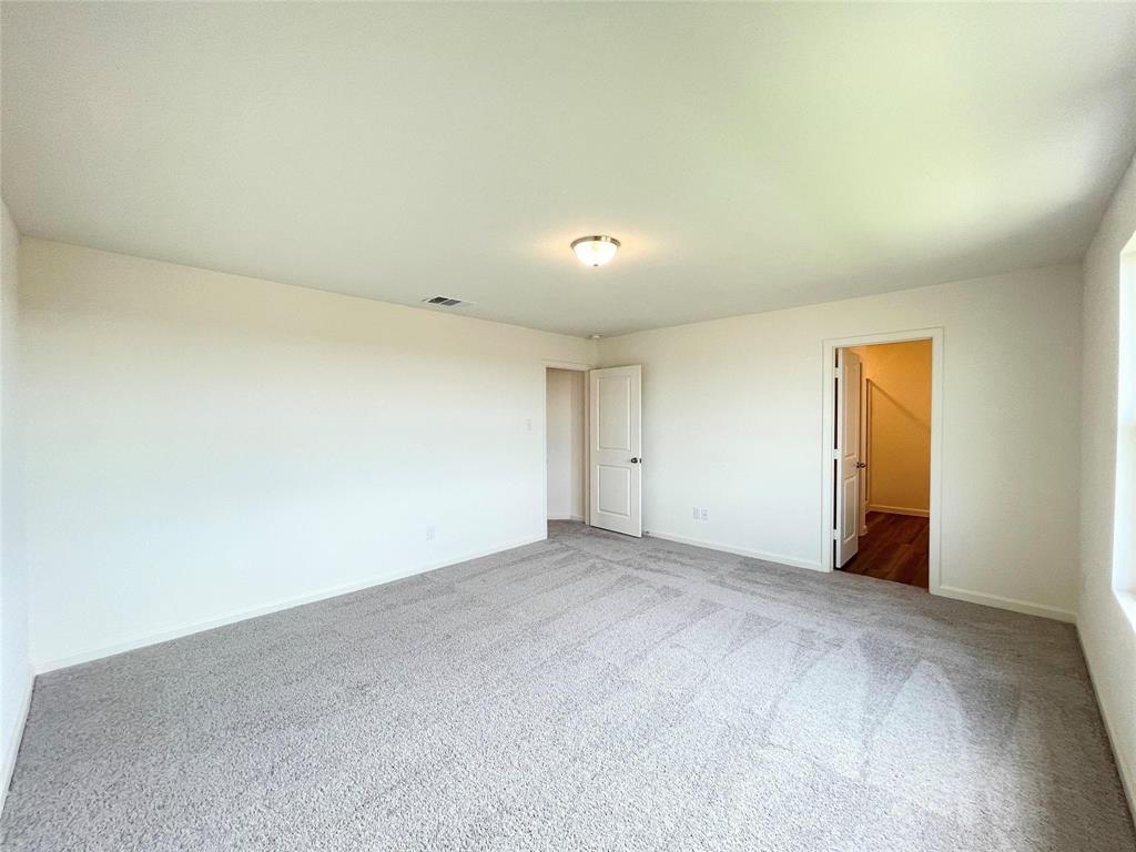 1702 Chapel Hl Road Princeton, TX 75407 - Photo 16 of 24 an empty room with a natural light