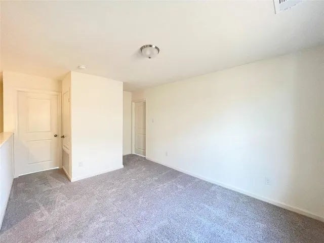 a bathroom with a tub shower and sink