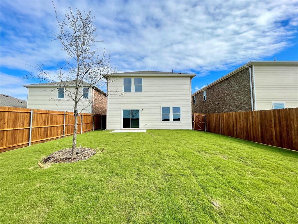 1702 Chapel Hl Road Princeton, TX 75407 - Photo 20 of 24 a house is sitting in middle of the grass