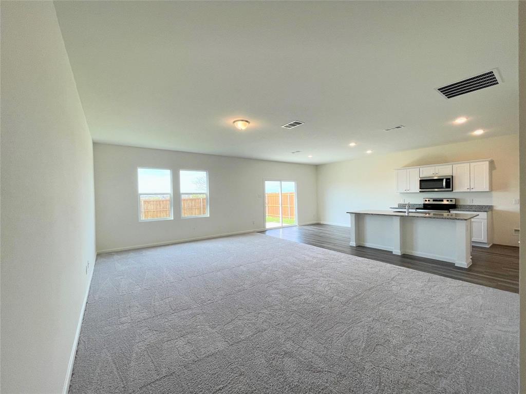 1702 Chapel Hl Road Princeton, TX 75407 - Photo 3 of 24 a view of empty room with kitchen and window