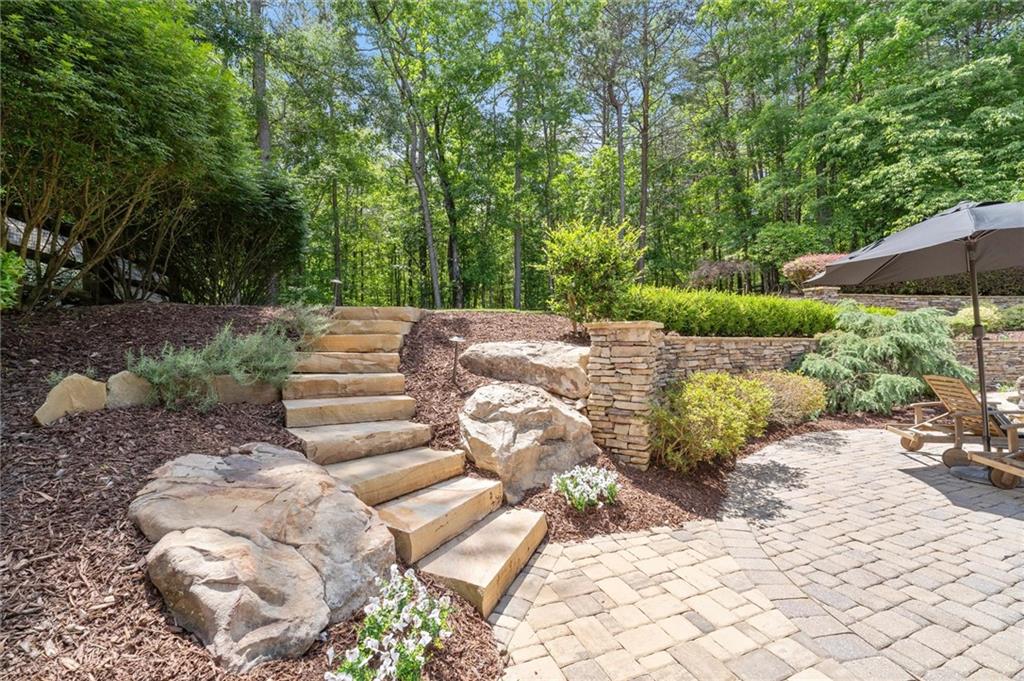 6229 Grand Loop Road Sugar Hill, GA 30518 - Photo 75 of 93 a view of a backyard with green space