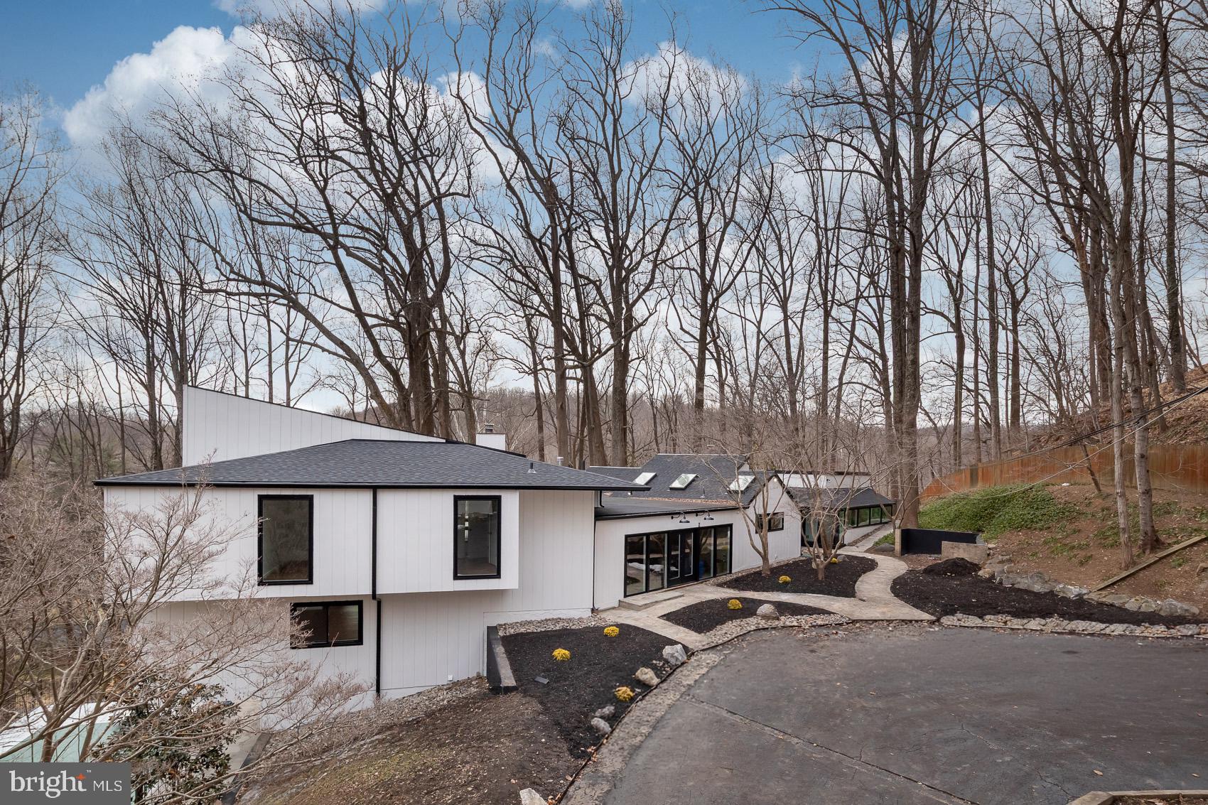 Modern home nestled in serene woods.