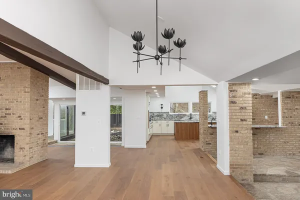 a view of an entryway with wooden floor