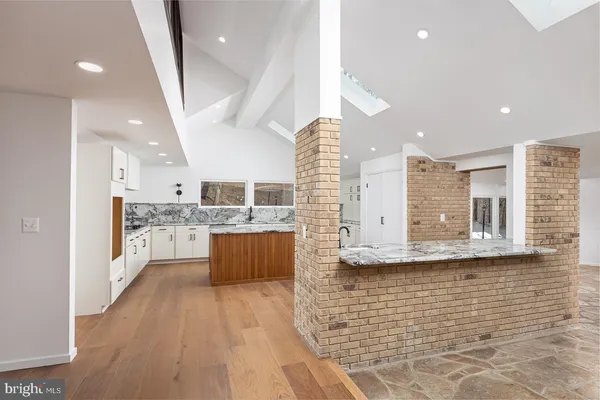 a bathroom with a double vanity sink mirror and shower
