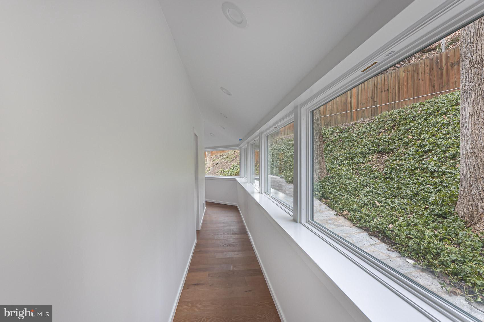 903 Ivy Hill Road Cockeysville, MD 21030 - Photo 39 of 95 Bright corridor with lush greenery views.