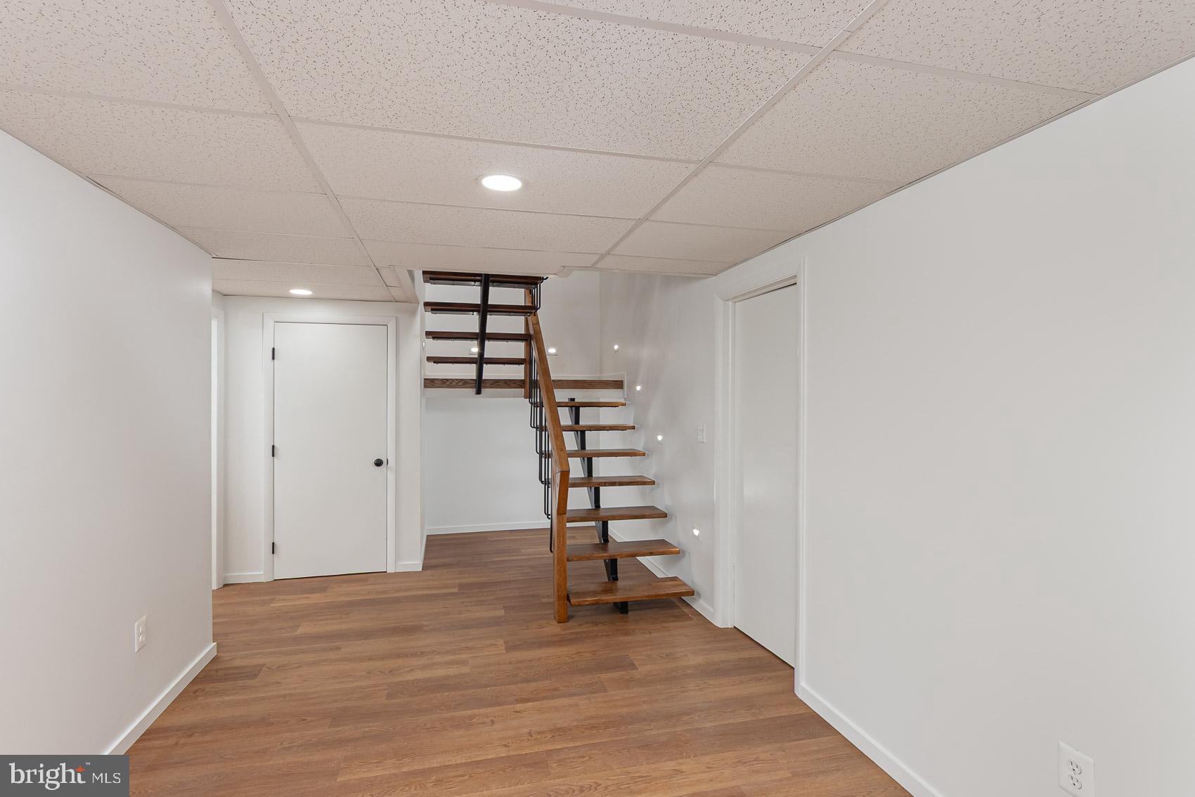 903 Ivy Hill Road Cockeysville, MD 21030 - Photo 74 of 95 Bright and airy basement with wooden stairs.