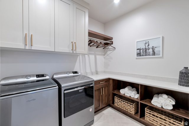 2145 North Main Street Centerville, UT 84014 - Photo 22 of 53 Laundry area featuring washing machine and dryer and cabinet space