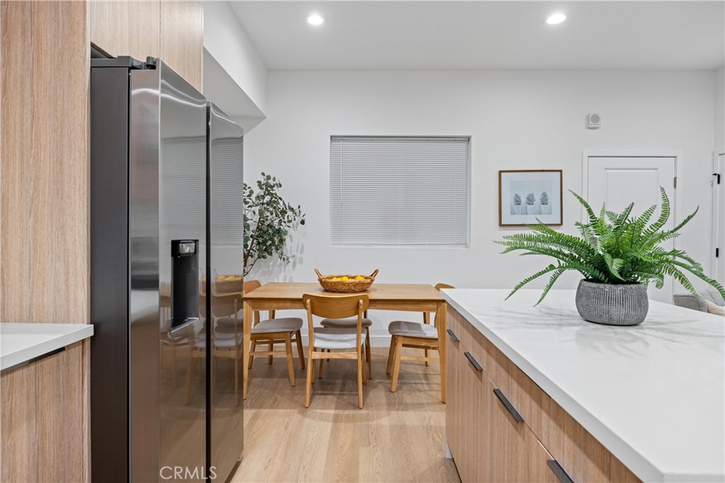 13857 Leffingwell Road Whittier, CA 90604 - Photo 19 of 32 a dining room with furniture and potted plant