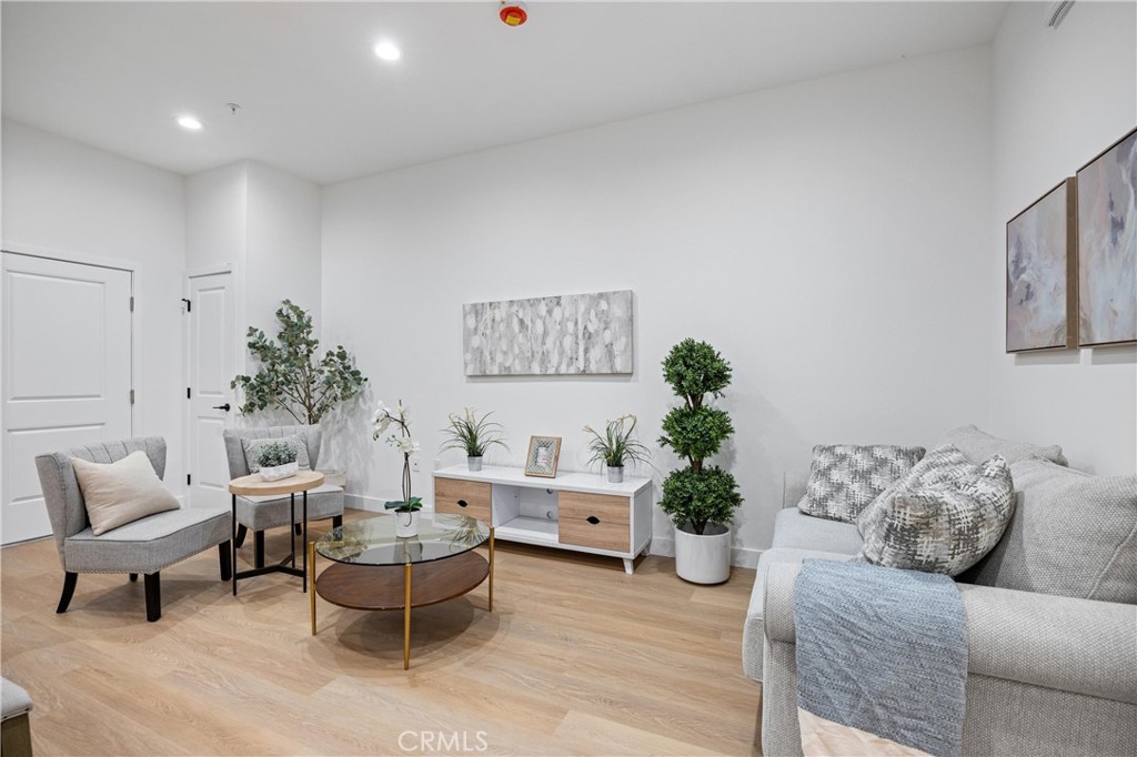 13857 Leffingwell Road Whittier, CA 90604 - Photo 22 of 32 a living room with furniture and a potted plant