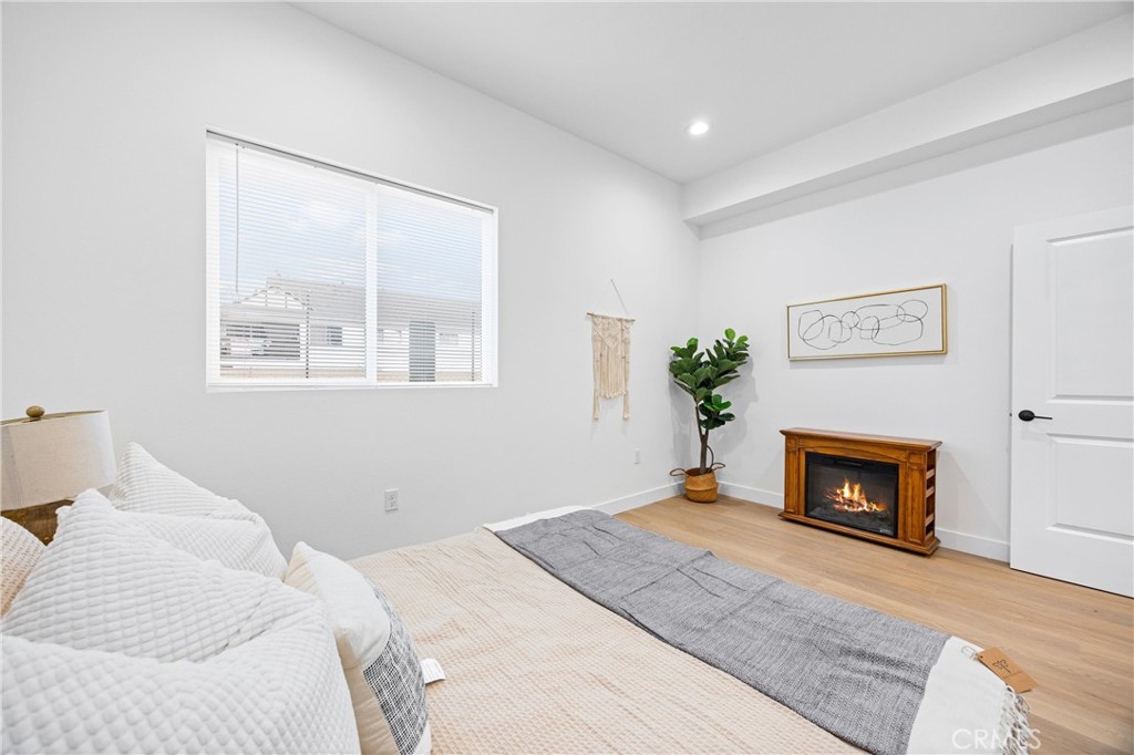 13857 Leffingwell Road Whittier, CA 90604 - Photo 31 of 32 a bedroom with a bed and a fireplace