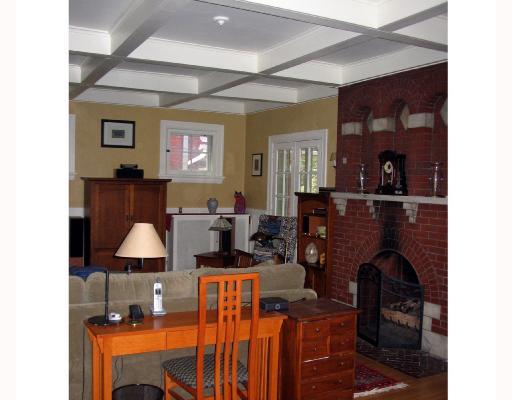 5846 Darlington Road Pittsburgh, PA 15217 - Photo 6 of 8 Living Room. Large living room has original stone and brick fireplace, and French doors leading out onto the front porch.