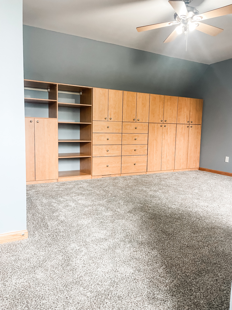 1308 Axcel Lane Sycamore, IL 60178 - Photo 18 of 40 a view of an empty room with a fireplace