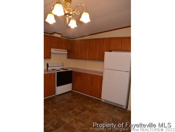 5118 Maxwell Road Stedman, NC 28391 - Photo 4 of 13 a kitchen with a refrigerator and a sink