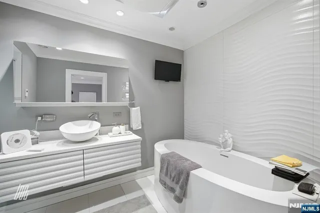 a bathroom with a sink and mirror