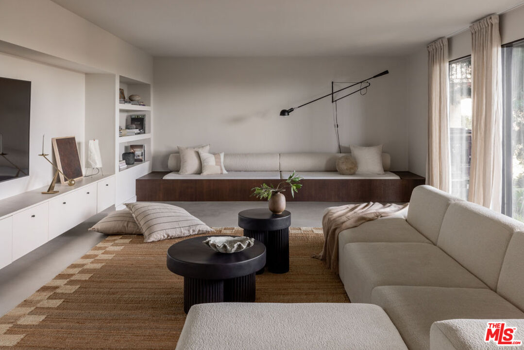 300 Anita Drive Pasadena, CA 91105 - Photo 18 of 26 a living room with furniture and a flat screen tv