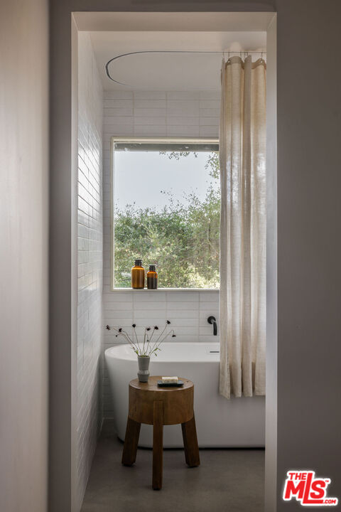 300 Anita Drive Pasadena, CA 91105 - Photo 21 of 26 a room with a large window and a table chair