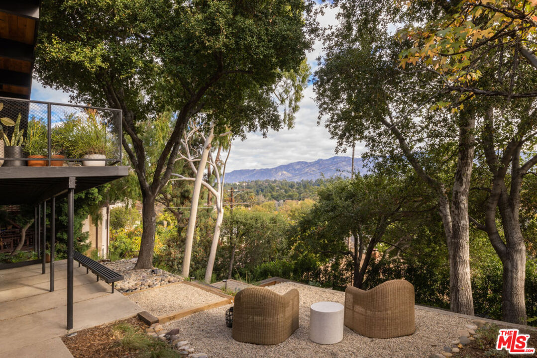 300 Anita Drive Pasadena, CA 91105 - Photo 22 of 26 a backyard of a house with table and chairs