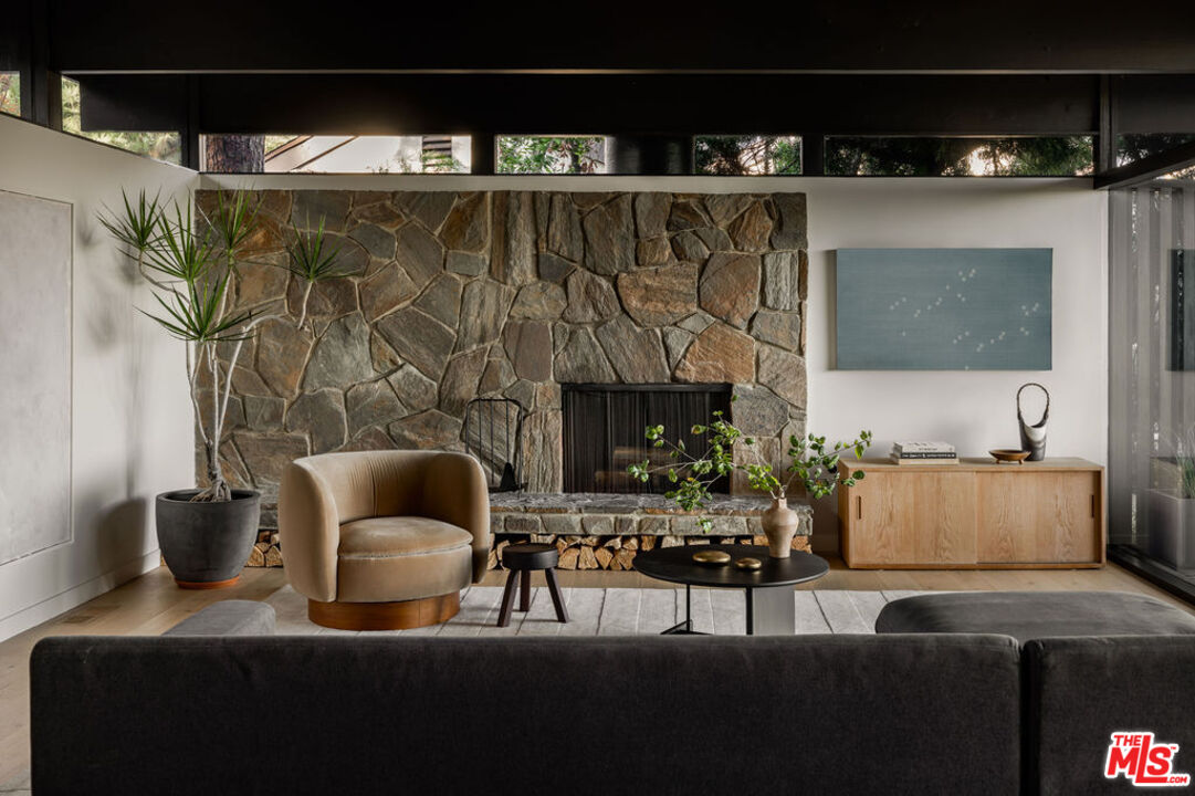 300 Anita Drive Pasadena, CA 91105 - Photo 4 of 26 a living room with furniture and a fireplace