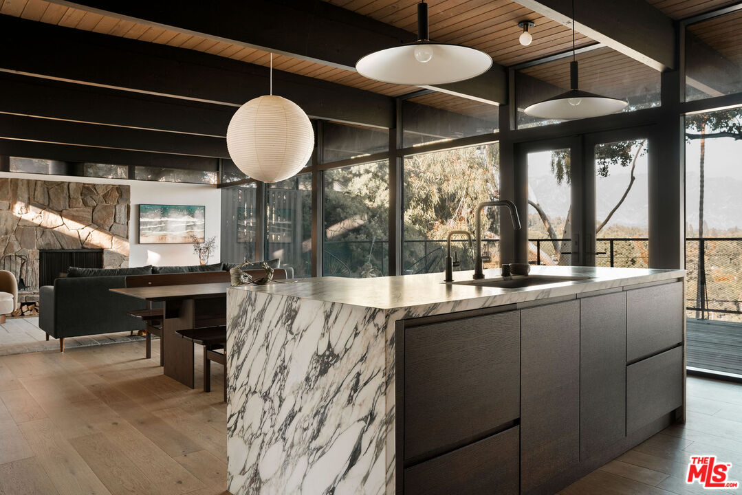 300 Anita Drive Pasadena, CA 91105 - Photo 8 of 26 a kitchen with stainless steel appliances granite countertop a stove and a sink