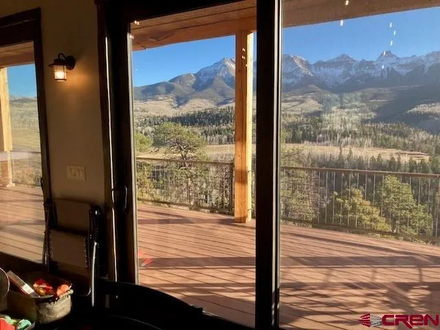 a view of a glass door and a porch