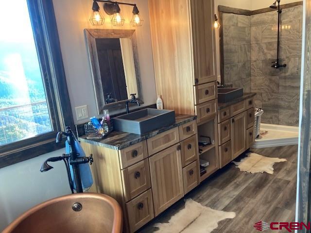 8935 County Road 5 Ridgway, CO 81432 - Photo 20 of 35 a bathroom with a granite countertop sink toilet and shower