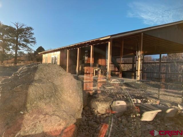 8935 County Road 5 Ridgway, CO 81432 - Photo 27 of 35 a front view of a house with a yard
