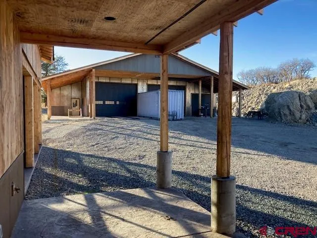 a view of a house with a yard and garage