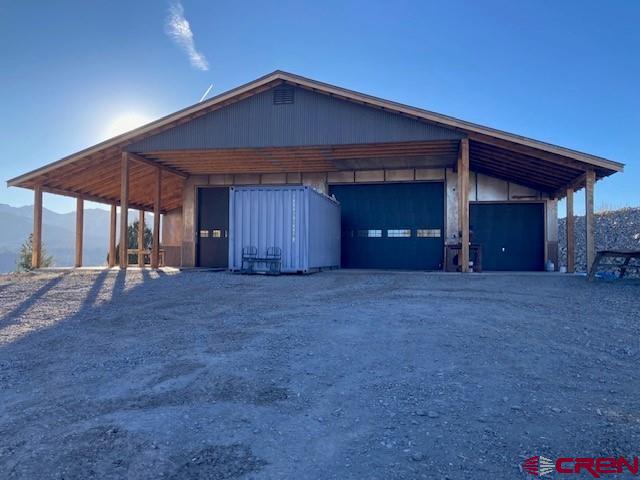 8935 County Road 5 Ridgway, CO 81432 - Photo 30 of 35 a view of a house with a yard and garage