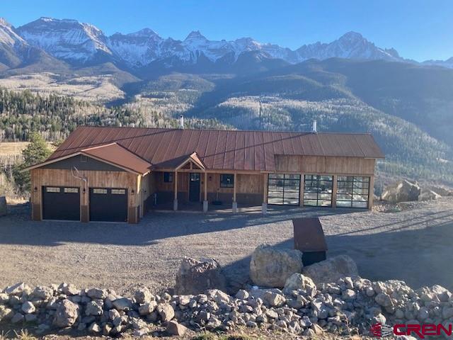8935 County Road 5 Ridgway, CO 81432 - Photo 33 of 35 a front view of a house with a yard