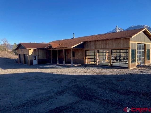 8935 County Road 5 Ridgway, CO 81432 - Photo 4 of 35 a front view of a house with a yard