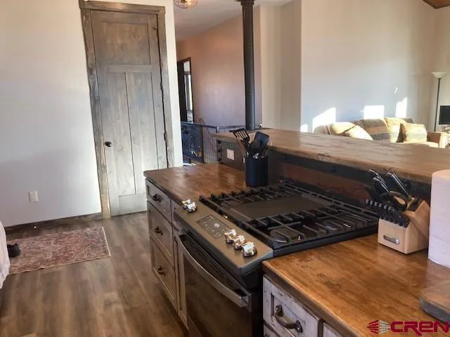 a stove top oven sitting inside of a kitchen