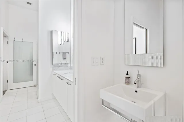 a view of a hallway with washer and dryer