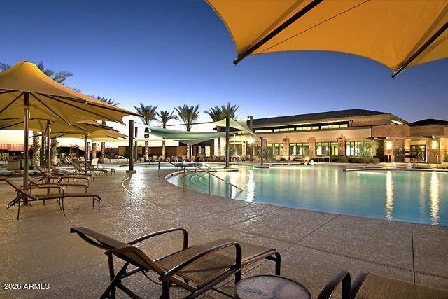 8144 West Silver Spring Way Florence, AZ 85132 - Photo 64 of 82 Twilight View of Outdoor Resort Pool