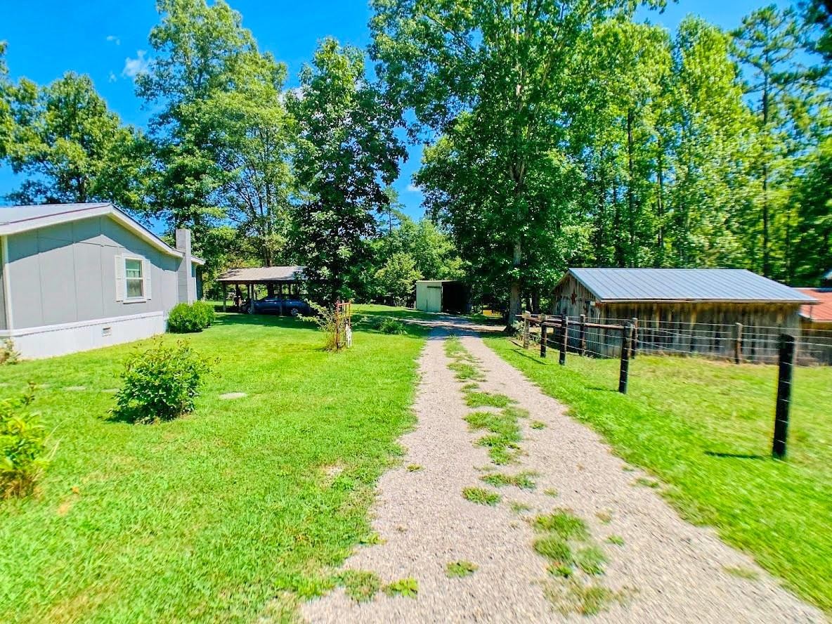 149 Fire Hall Road Jamestown, TN 38556 - Photo 5 of 37 a view of backyard with swimming pool and green space