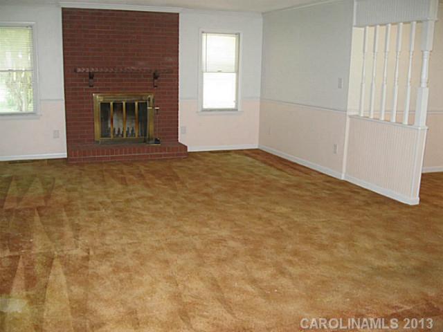 321 Fieldstone Road Mooresville, NC 28115 - Photo 3 of 10 a view of an empty room with a fireplace
