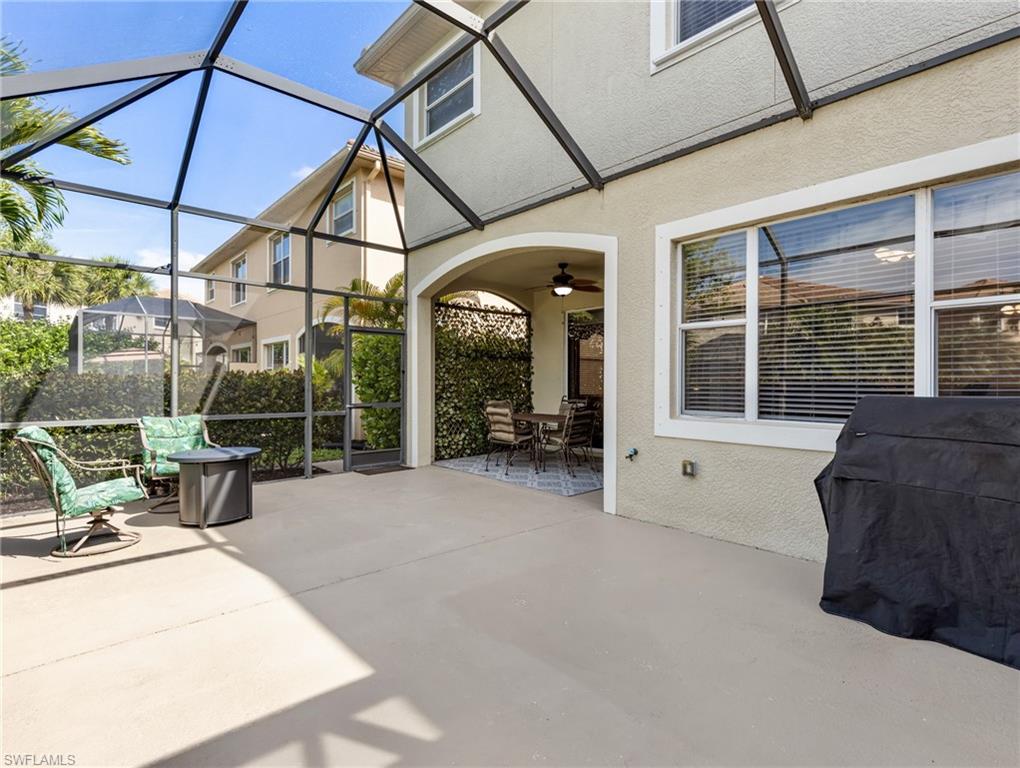 20026 Larino Loop Estero, FL 33928 - Photo 11 of 48 a view of a house with backyard porch and sitting area