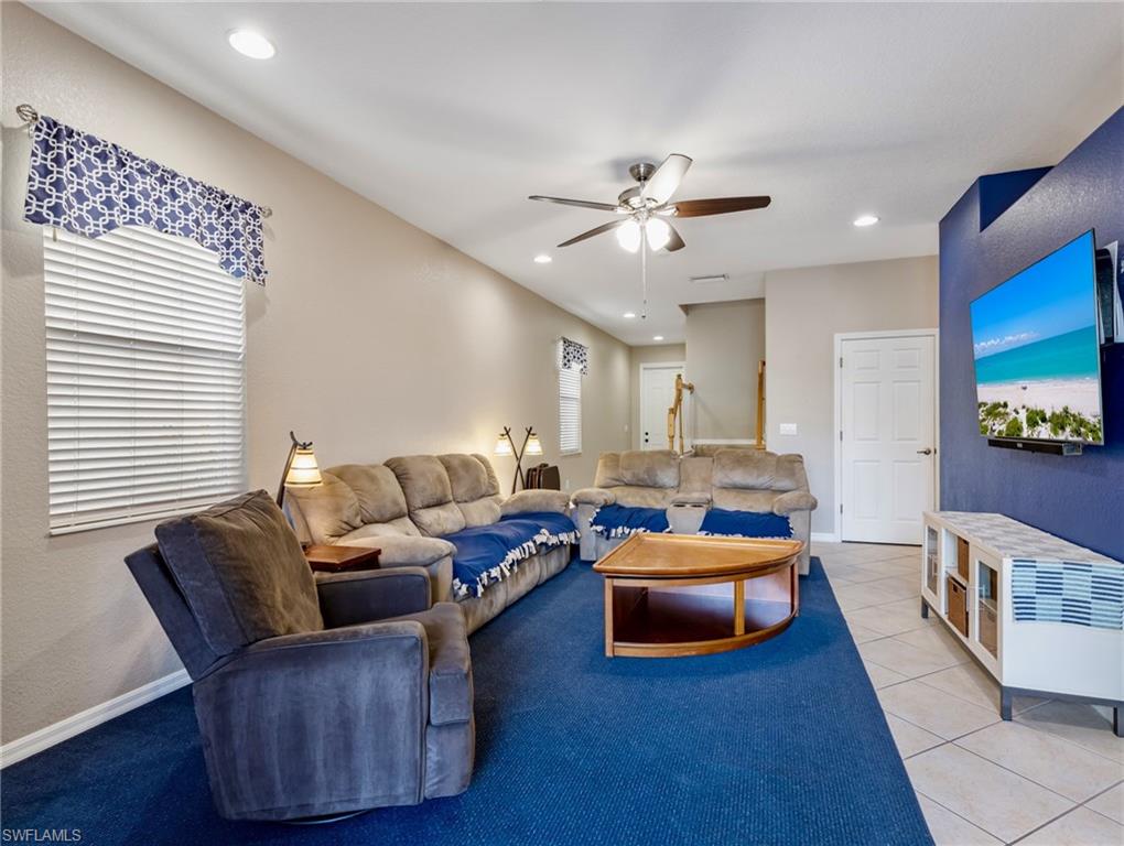 20026 Larino Loop Estero, FL 33928 - Photo 13 of 48 a living room with furniture and a flat screen tv