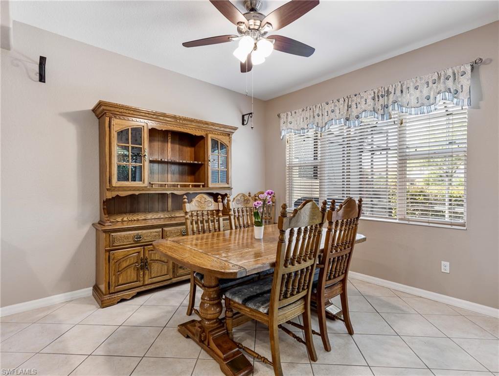 20026 Larino Loop Estero, FL 33928 - Photo 21 of 48 a dining room with furniture and window
