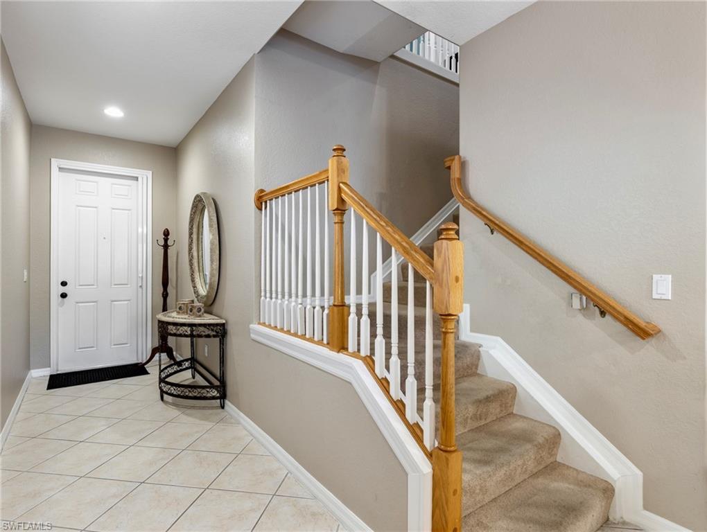 20026 Larino Loop Estero, FL 33928 - Photo 23 of 48 a view of a hallway with staircase