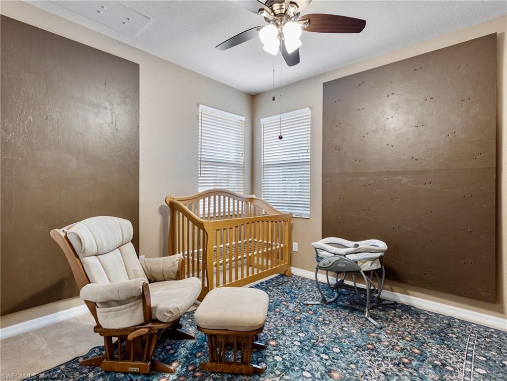 20026 Larino Loop Estero, FL 33928 - Photo 29 of 48 a living room with furniture a rug and a window